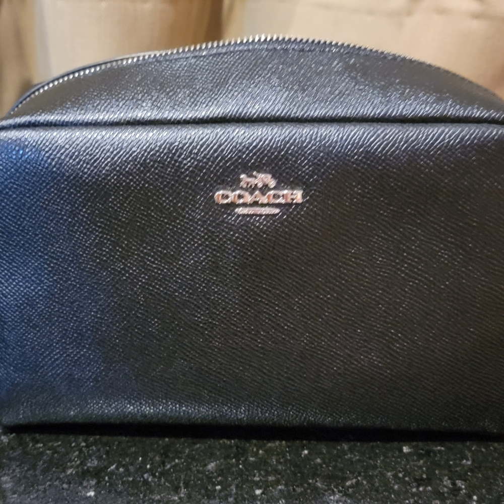 Coach black makeup bag. Used once. Great bag...I just needed more space.